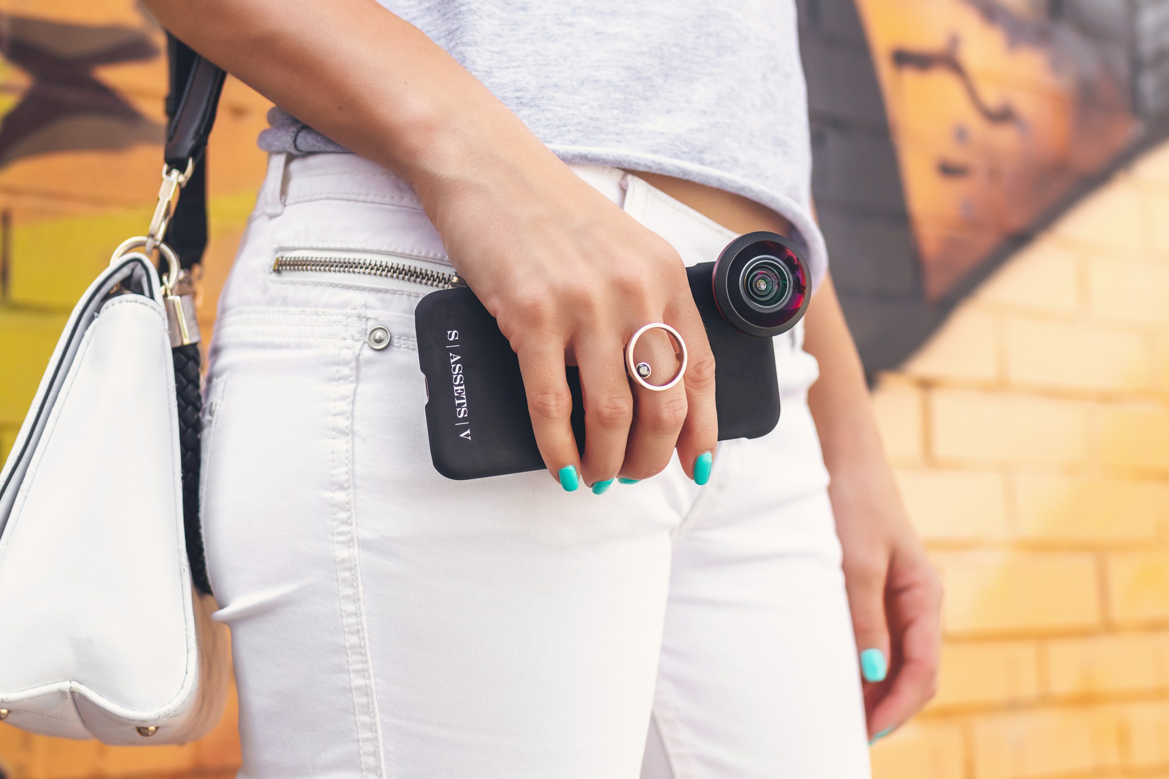 person with camera - How to Take Pictures of Jewelry With a Phone