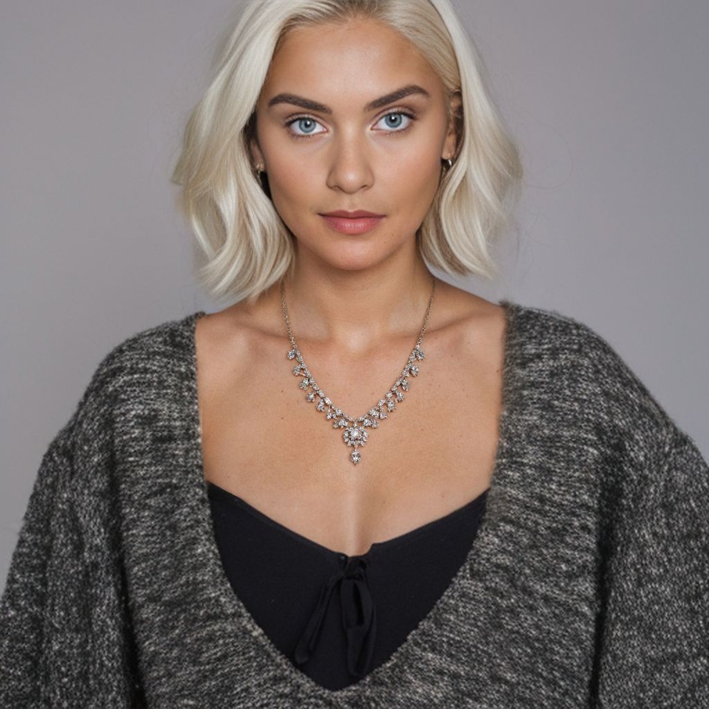 25 year old caucasian model wearing detailed necklace, mid-range shot includes shoulders - this time with blonde hair