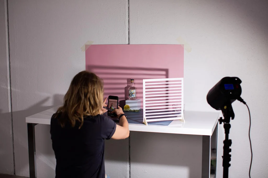 woman taking photographs - Creative Product Photography Ideas At Home