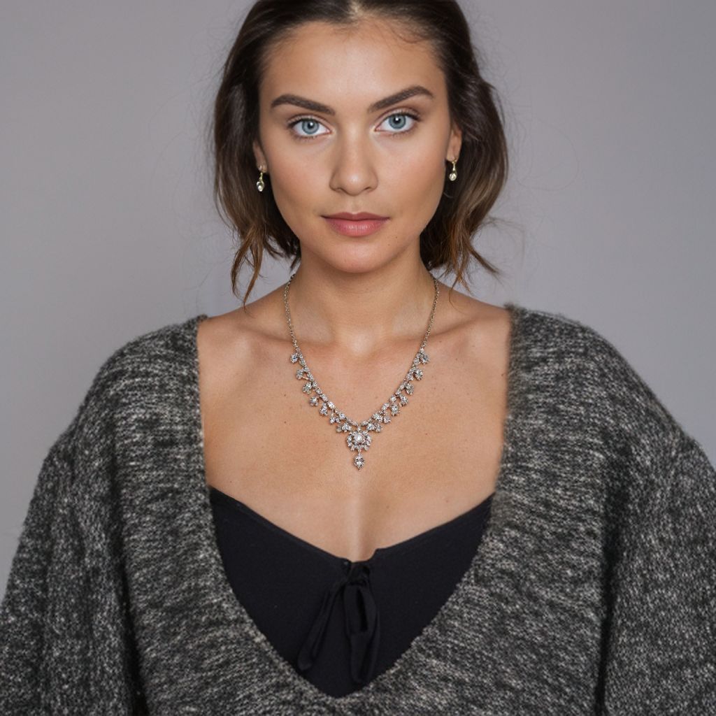 25 year old caucasian model wearing detailed necklace, mid-range shot includes shoulders 