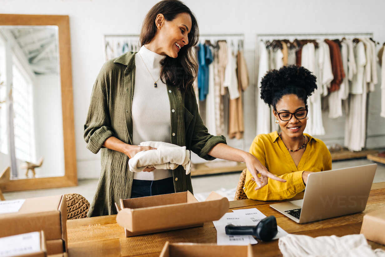 woman preparing package - Scaling eCommerce Business