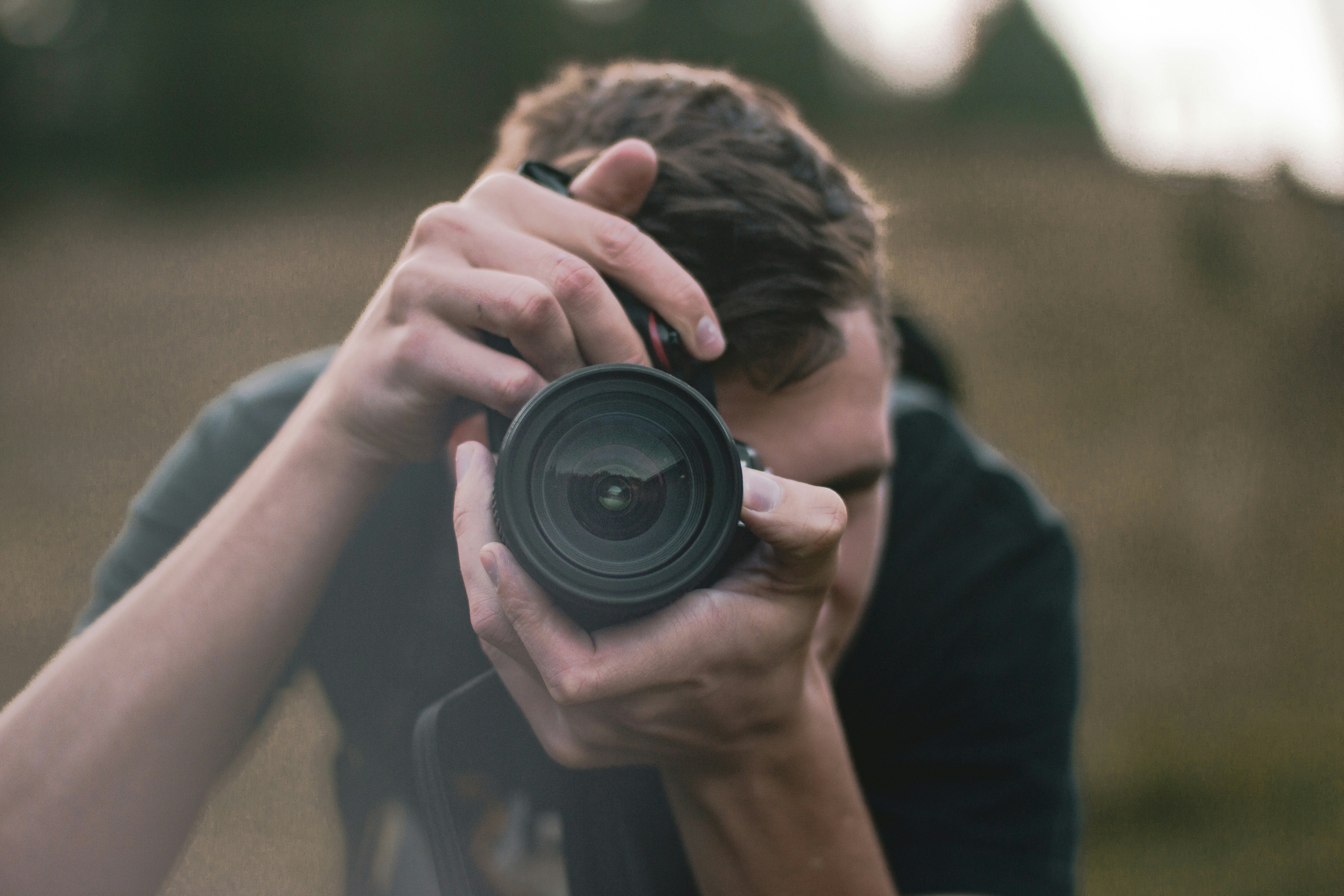 person taking picture - How To Shoot Product Photography
