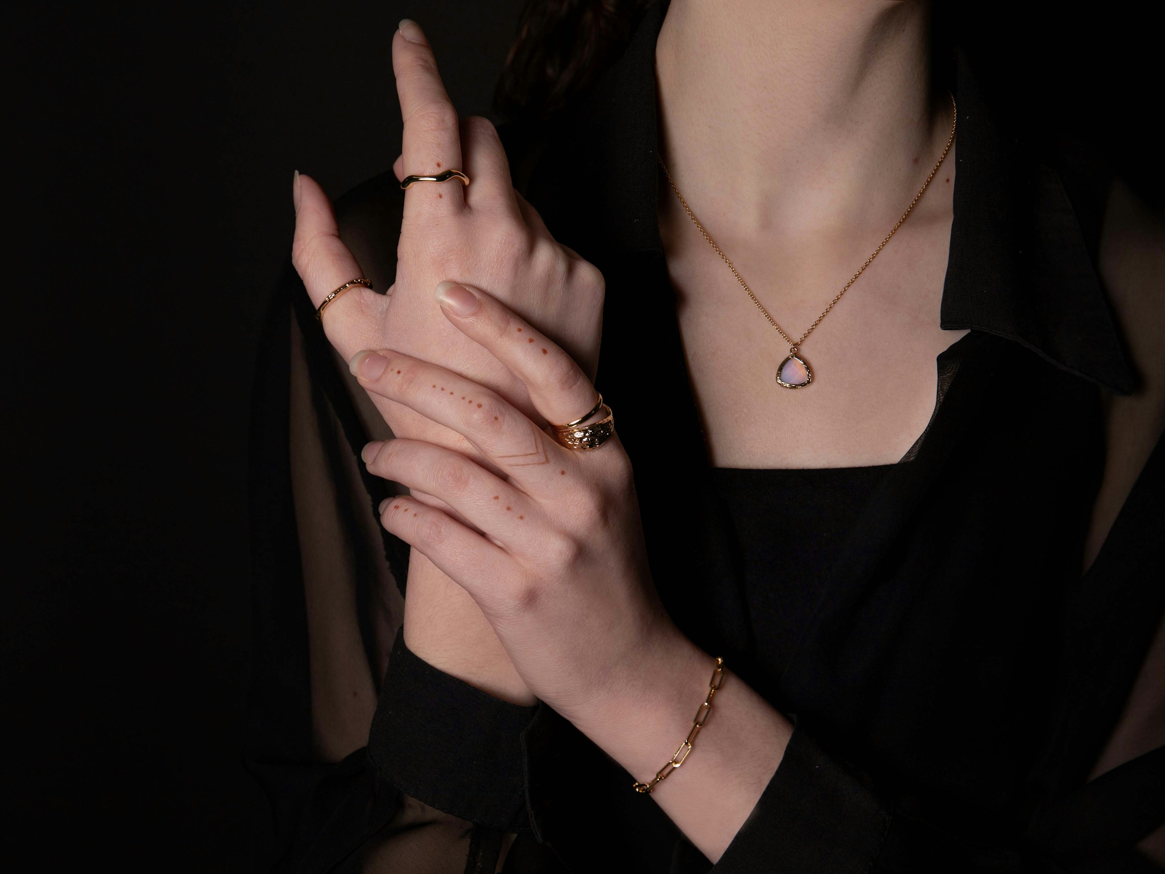 person showing off her jewls - How to Take Pictures of Jewelry With a Phone