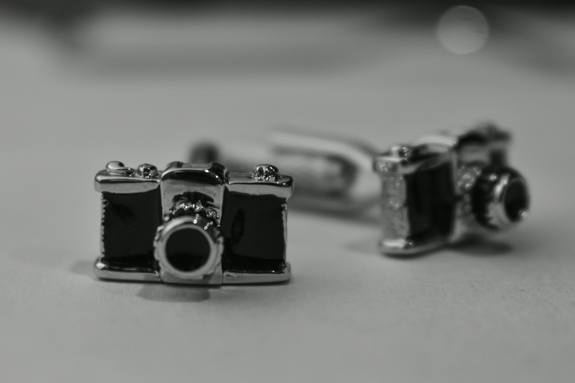 Cameras Laying - Best Lens for Jewelry Photography